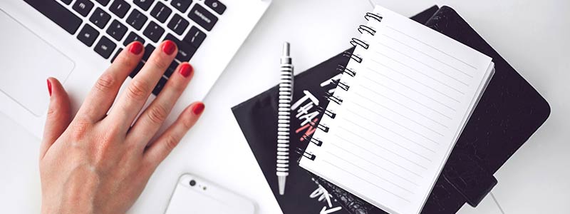 woman-hand-smartphone-desk-work